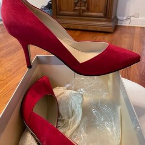 Red suede pumps